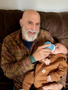 Picture of Steven with his grandson.